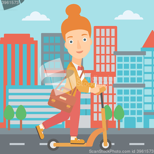 Image of Woman riding on scooter.