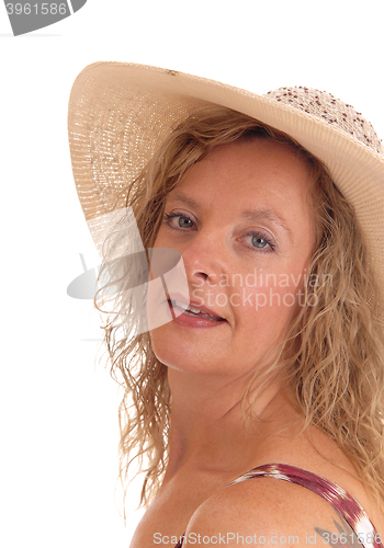 Image of Closeup of woman with straw had hat.