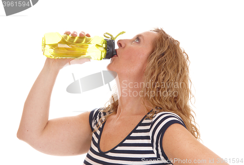 Image of Workout woman drinking from her water bottle.