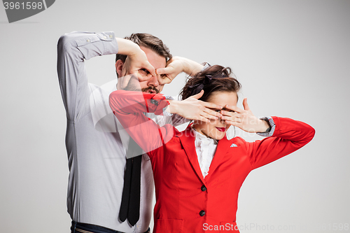 Image of The business man and woman closing eyes