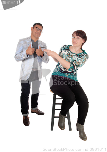 Image of Woman pointing finger at her husband.