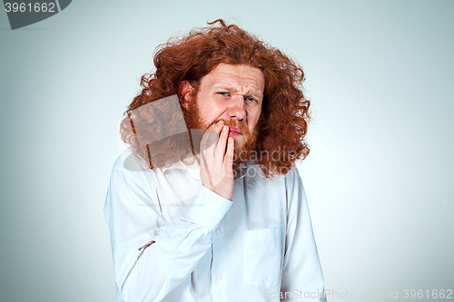 Image of Young man is having toothache.