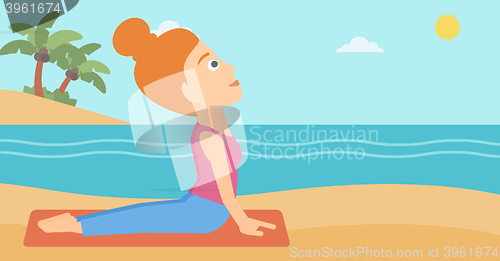 Image of Woman practicing yoga.