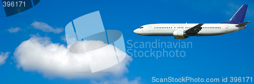 Image of Air travel - Plane and cloud on blue sky