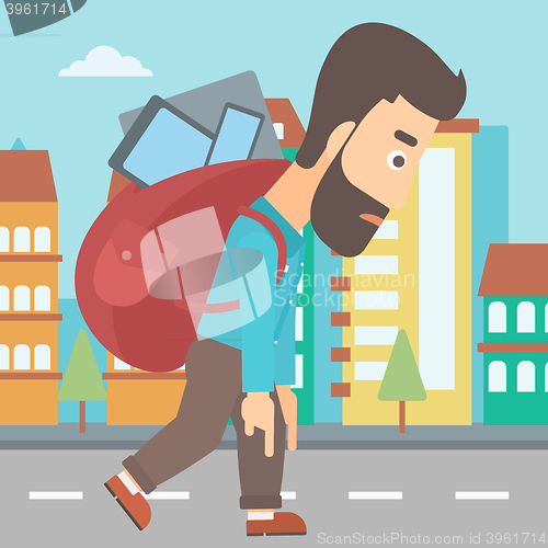 Image of Man with backpack full of devices.