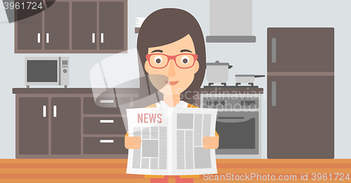 Image of Woman reading newspaper.