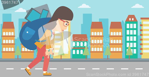 Image of Woman with backpack full of devices.