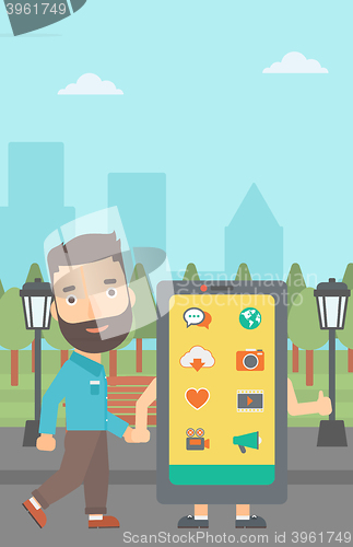 Image of Man walking with smartphone.