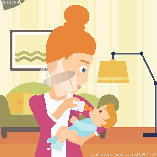 Image of Woman feeding baby.