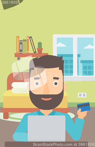 Image of Man making purchases online.