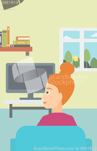 Image of Woman watching TV.