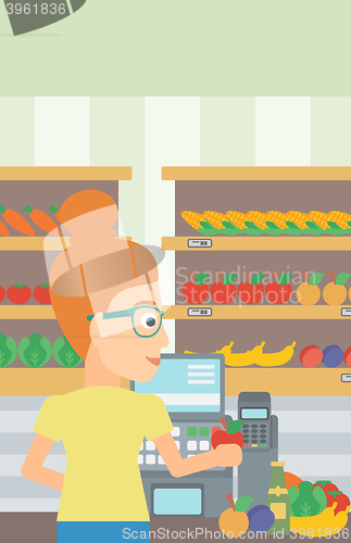 Image of Cashier at supermarket checkout.