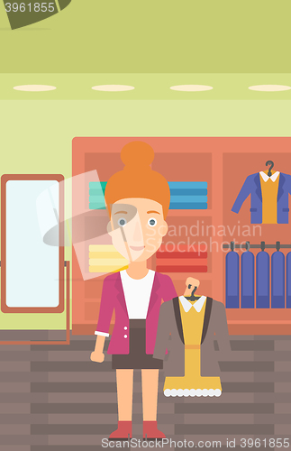 Image of Woman holding dress with jacket.
