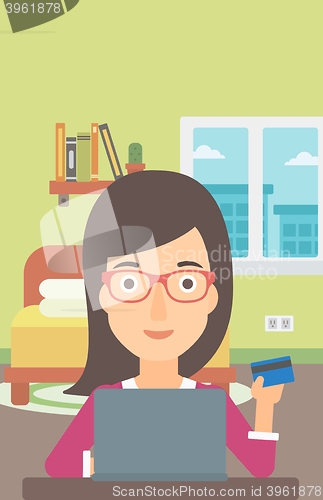 Image of Woman making purchases online.