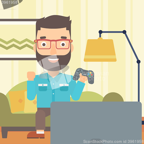 Image of Man playing video game.