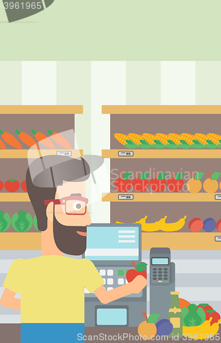 Image of Cashier at supermarket checkout.