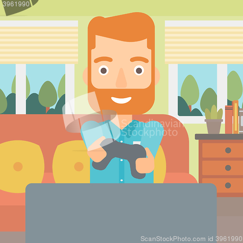 Image of Man playing video game.