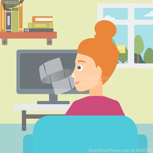 Image of Woman watching TV.