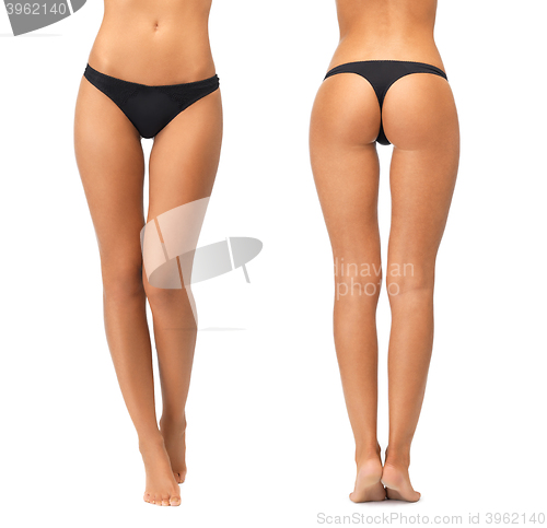 Image of female legs and bottom in black bikini panties