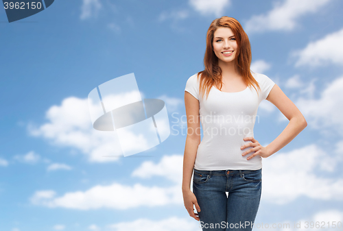 Image of happy young woman or teenage girl in white t-shirt