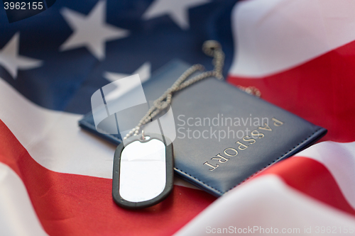 Image of american flag, passport and military badge