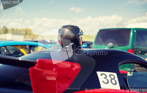 Image of close up of car with helmet on roof top