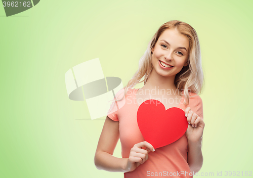 Image of happy woman or teen girl with red heart shape