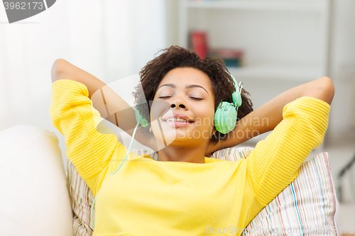 Image of happy woman with headphones listening to music