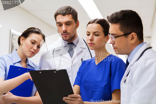 Image of group of medics with clipboards at hospital