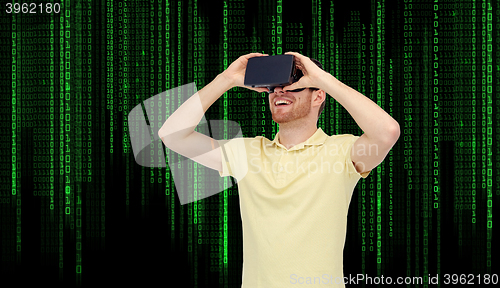 Image of happy man in virtual reality headset or 3d glasses