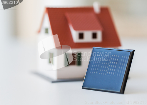 Image of close up of house model and solar battery or cell