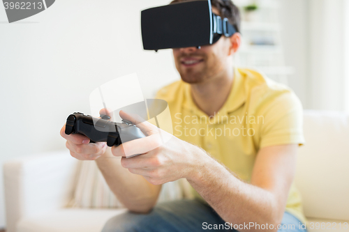 Image of close up of man in virtual reality headset playing