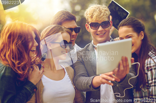 Image of students or teenagers with tablet pc taking selfie