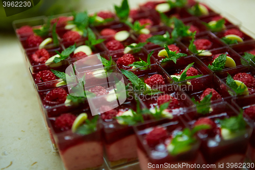 Image of Dessert table for party. akes and sweetness. Shallow dof