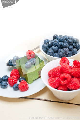 Image of green tea matcha mousse cake with berries