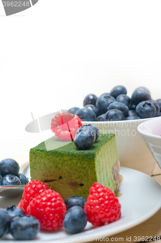 Image of green tea matcha mousse cake with berries