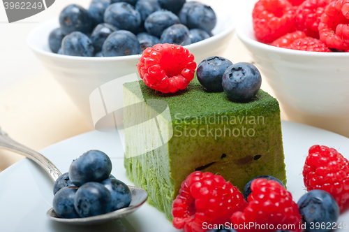 Image of green tea matcha mousse cake with berries