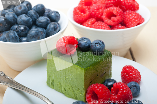 Image of green tea matcha mousse cake with berries