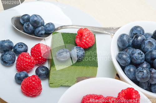 Image of green tea matcha mousse cake with berries