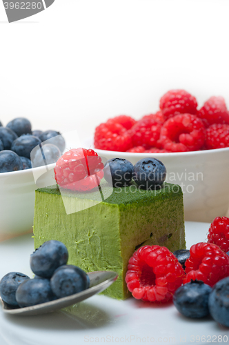 Image of green tea matcha mousse cake with berries