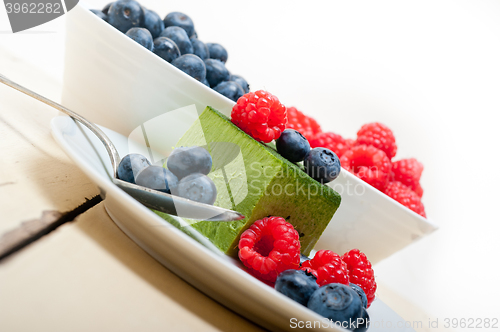 Image of green tea matcha mousse cake with berries