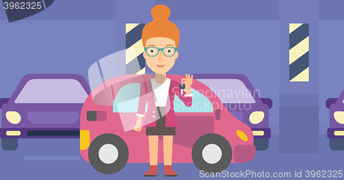 Image of Woman holding keys from new car.