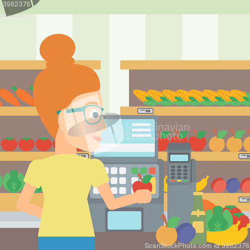 Image of Cashier at supermarket checkout.