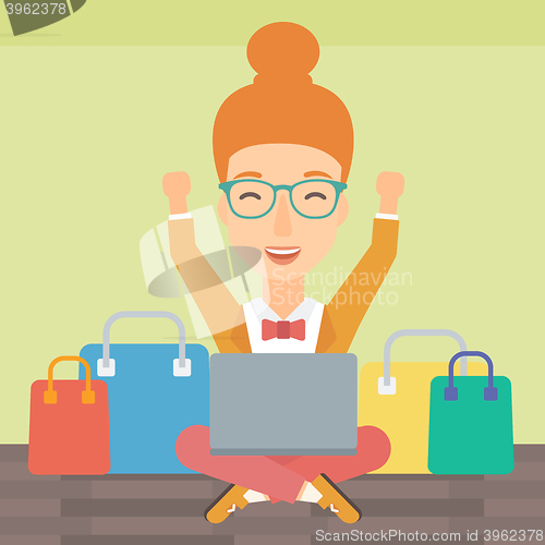 Image of Woman making purchases online.