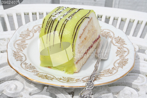 Image of Pastry with cream and green marsipan