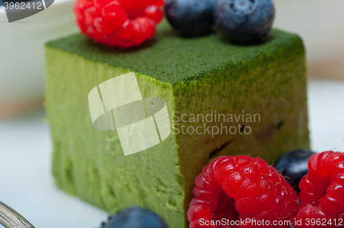 Image of green tea matcha mousse cake with berries