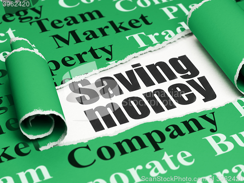 Image of Business concept: black text Saving Money under the piece of  torn paper