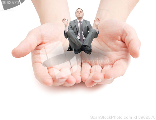 Image of Businessman meditating