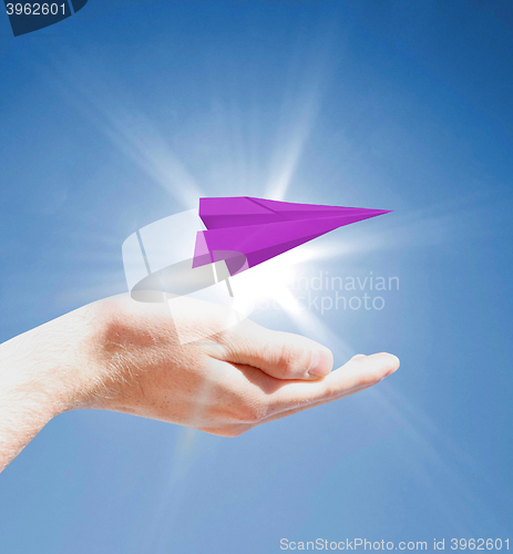 Image of Holding a paperplane