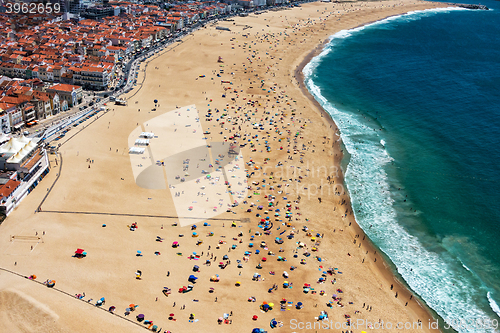 Image of Beach from Above with Many Umbrellas and People